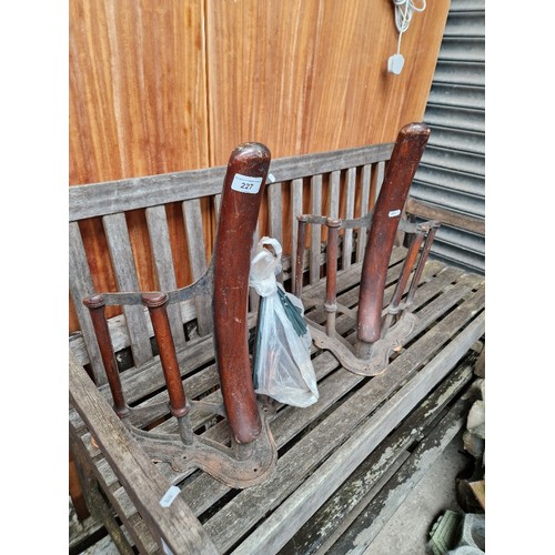 227 - A pair of saddle racks with tack brackets, by Musgrave and Co, Belfast & London.