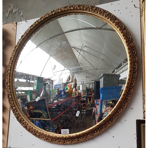 818 - A vintage gilt framed convex mirror, 67.5cm diameter (overall).