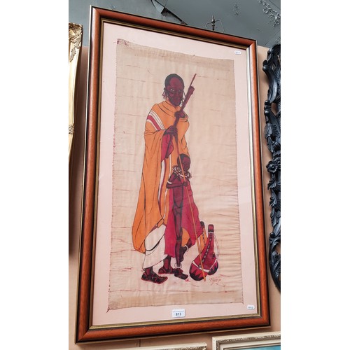 813 - An African painting on fabric depicting a Masai man and child, signed 'P Njomjo' to lower right, fra... 