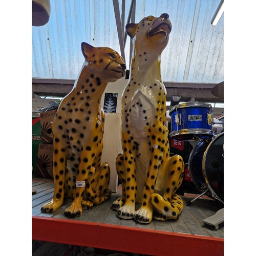 239 - Two resin cheetah animal figures, height 73cm and 56cm.