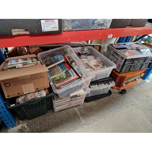 323 - Four boxes of books including cricket and travel, three boxes of cassettes and CDS and a gramophone ... 