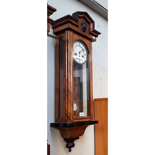 890 - A walnut cased Vienna wall clock.