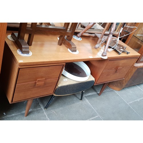 898 - A mid 20th century G Plan teak dressing table.