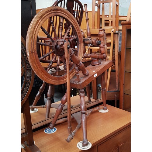 900 - An oak spinning wheel.