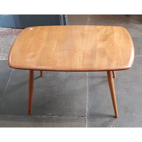 909 - A mid 20th century Ercol light elm coffee table, length 72.5cm.