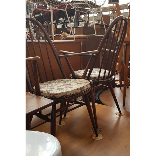 914 - A pair of Ercol dark elm Quaker carver chairs.