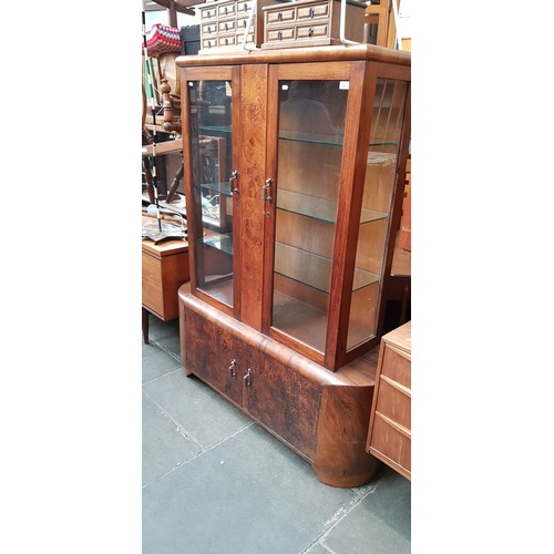 903 - A 1930s Art Deco walnut display cabinet.