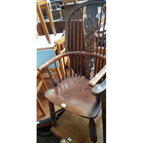 920 - A 19th century elm and yew wood Windsor chair.