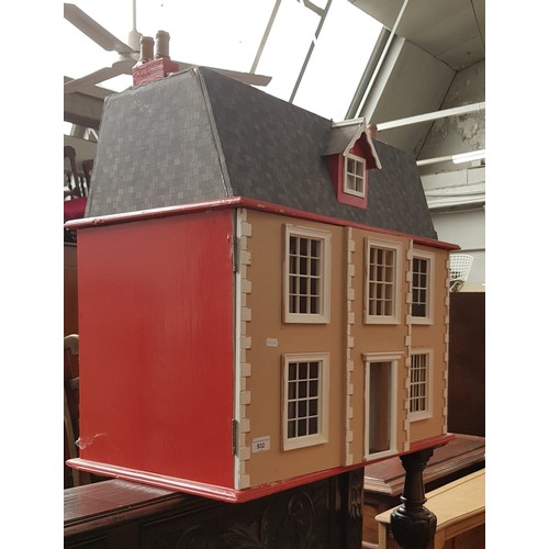 932 - A Georgian style two storey dolls house- unfurnished, length 72cm.