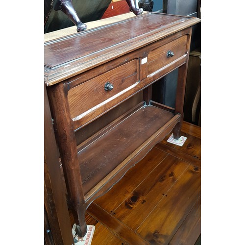 938 - A French aged oak console table with two drawers.