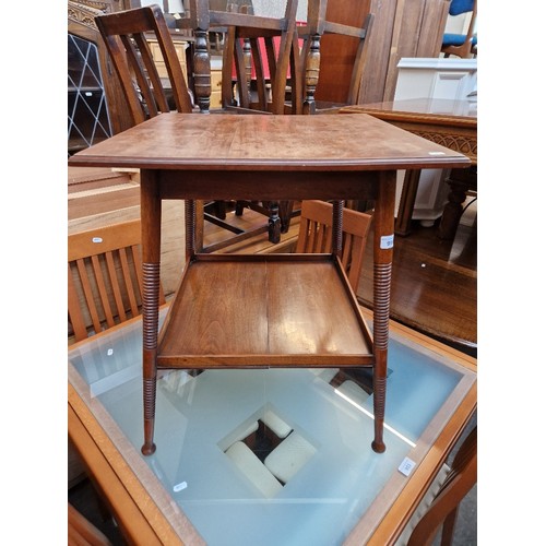 999 - A William Birch Edwardian Arts & Crafts walnut occasional table.