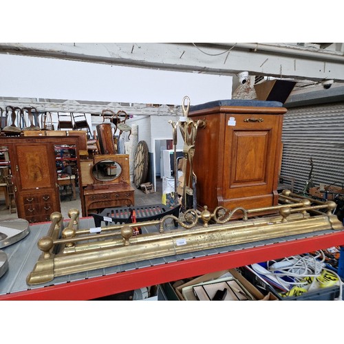 1004 - Two brass fire fenders, a walnut coal scuttle, fire crate, and a fire companion set.