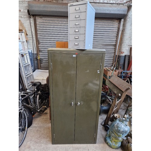 1005 - A large metal cabinet by Howden and a six drawer Bisley metal filing cabinet.