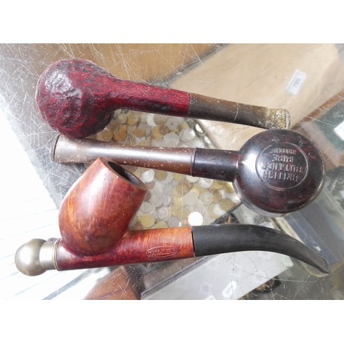 3 - A smokers cabinet with tobacco jar, three pipes and a cutter/pricker.