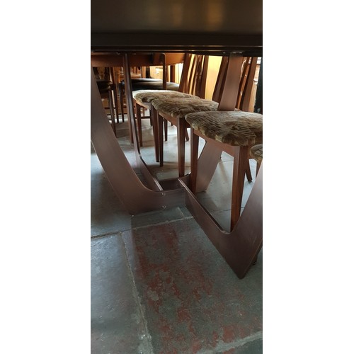 915 - An Italian walnut dining table on bronze base, length 220cm.