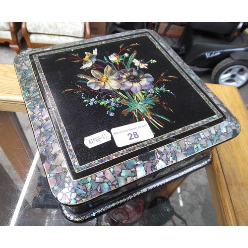 28 - A Victorian black lacquer and mother of pearl inlaid jewellery box with quilted interior and contain... 