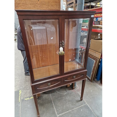 1029 - A mahogany display cabinet.