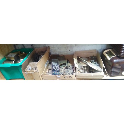 88 - A quantity of clock spares and two bakelite radios.