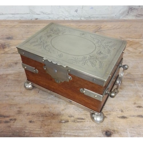 103 - A silver plated oak tea caddy, circa 1900, the tope engraved with butterflies and acorns.