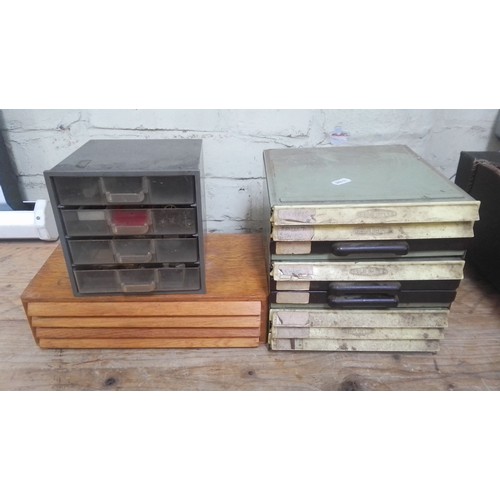 77 - Wooden, plastic and metal cabinets of watch spares.