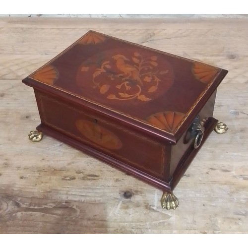 102 - An Edwardian inlaid mahogany box with cast brass handles and feet.