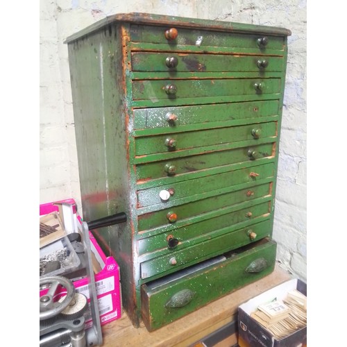 72 - A large green horologist's chest and contents comprising watch and clock making spares.