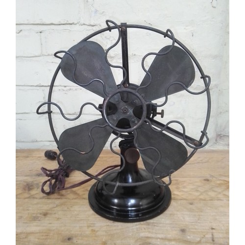 99 - A vintage Universal electric fan.