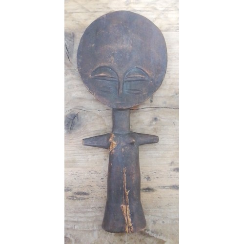 141 - An Ashanti wooden fertility figure, length 29cm.