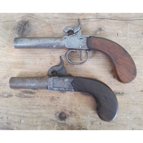 151 - Two 19th century percussion cap pistols, lengths 15.5cm & 17.5cm.