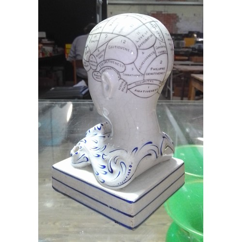 200 - A Bridges mid 19th century pottery phrenology head inkwell, height 14cm.