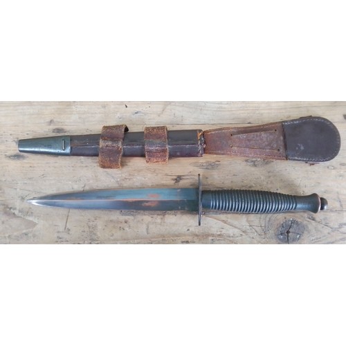 153 - A post war Fairbairn Sykes British commando dagger and sheath.