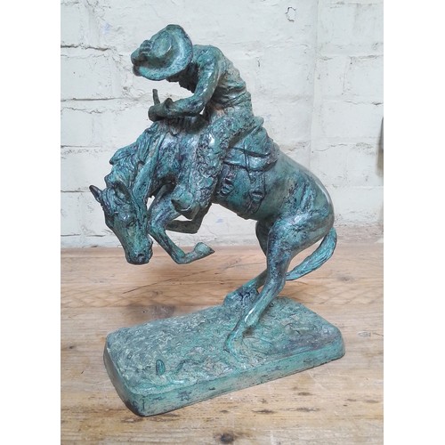 130 - After Frederic Remington (1861-1909), bronze modelled as a cowboy on horseback with rattlesnake, hei... 