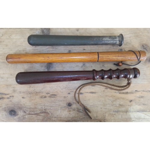 157 - A group of three truncheons, lengths 31cm to 45cm.