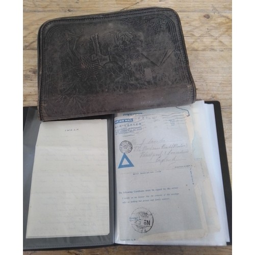 167 - A leather wallet from the Middle East containing WWII ephemera including letters, photographs, perso... 