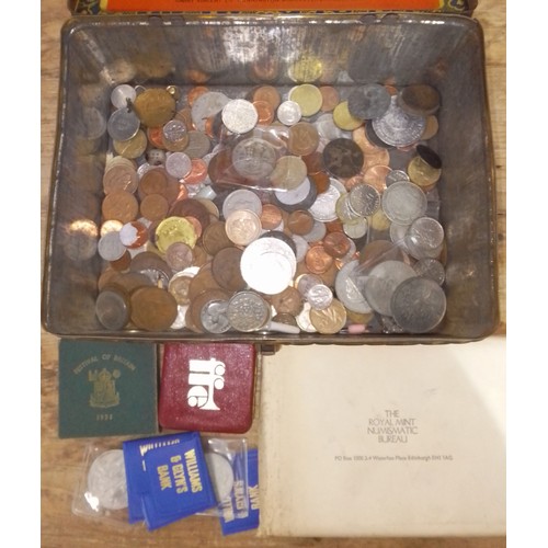 190 - A tin of assorted coins.