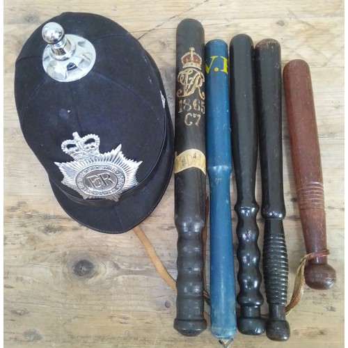 158 - A West Yorkshire Metropolitan Police helmet together with five truncheons, one bearing decoration wi... 