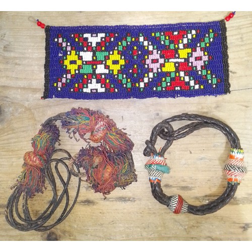 144 - African jewellery from Masi tribe from approx 1950's comprising symbolic beadwork and two leather br... 