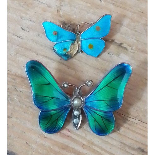 272 - A hallmarked silver and enamel butterfly pendant and another marked 'Sterling'.