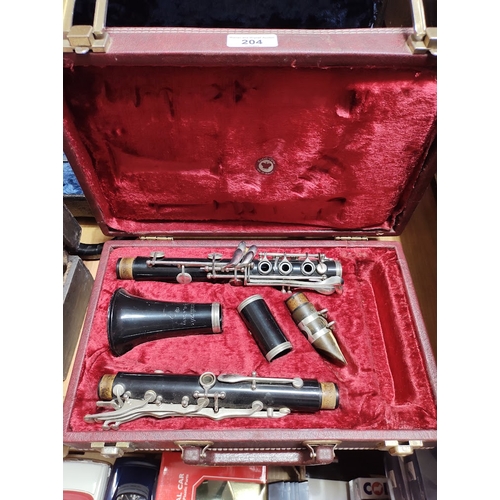 204 - A Rudall Carte clarinet, serial no.1077018, with hard case.