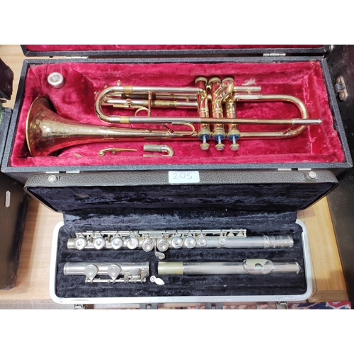 205 - A York trumpet, serial no.590302 and a Bundy flute, serial no.545213, both with hard cases.