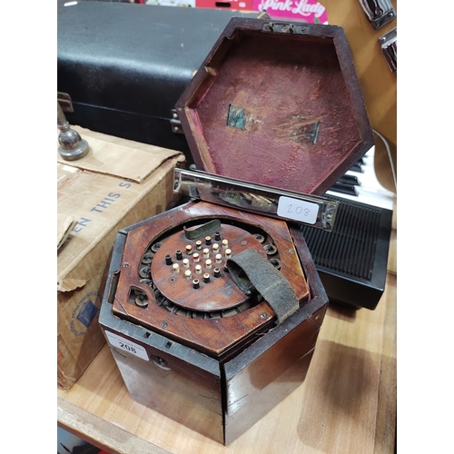 208 - A Victorian concertina squeeze box, the mahogany case marked 'G F Wilson, London', together with a C... 