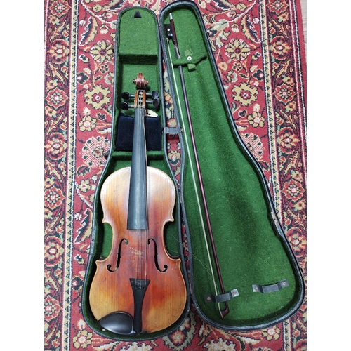 213 - A late 19th century violin, two piece back, length 360mm, with bow and hard case.