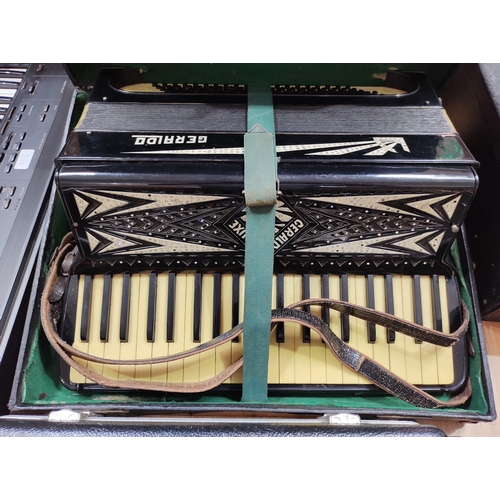 214 - A Geraldo accordion in hard case.