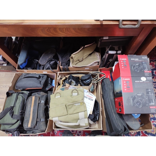 218 - Five boxes and two hard cases of cameras and accessories including 2 x Canon EOS 500D 35mm cameras, ... 