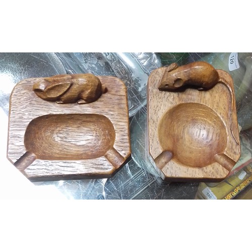 289 - Two English oak carved ashtrays, one by Robert 