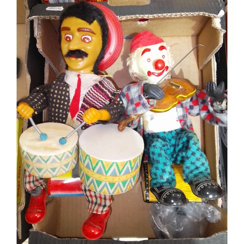 419 - Two Japanese Alps mechanical tinplate toys comprising of a seated Mexican drummer & a seated clown p... 