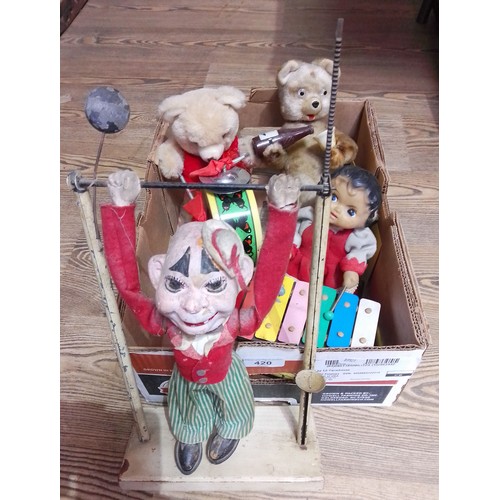 420 - A group of three vintage battery operated automaton toys comprising two bears and a xylophone player... 