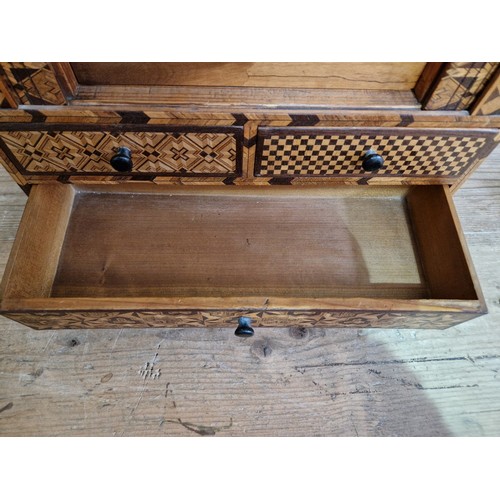 97 - A Japanese parquetry inlaid miniautre cabinet.