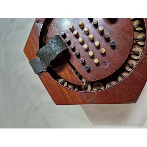 208 - A Victorian concertina squeeze box, the mahogany case marked 'G F Wilson, London', together with a C... 