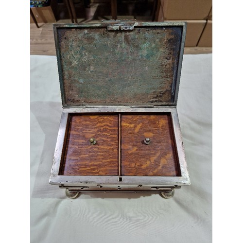 103 - A silver plated oak tea caddy, circa 1900, the tope engraved with butterflies and acorns.